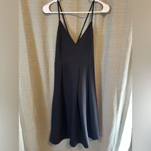 Elia Cher: Fit and Flare Black V Neck Dress